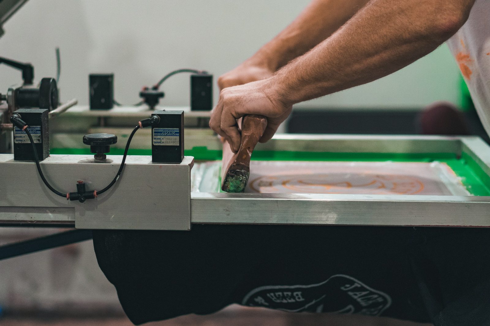 Custom printed products coming off a print-on-demand line