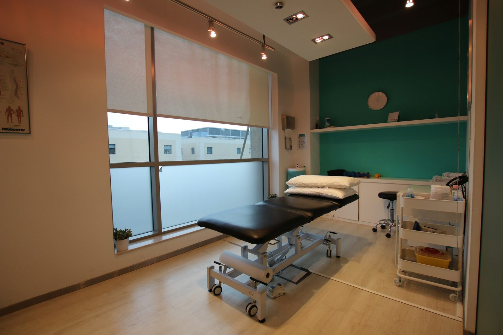 Physical therapy clinic with treatment tables