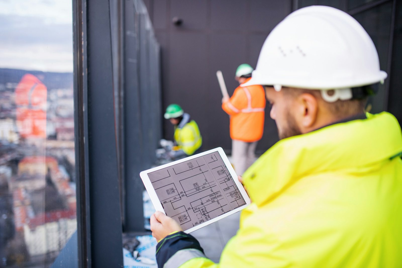 Field technician using job management app on site