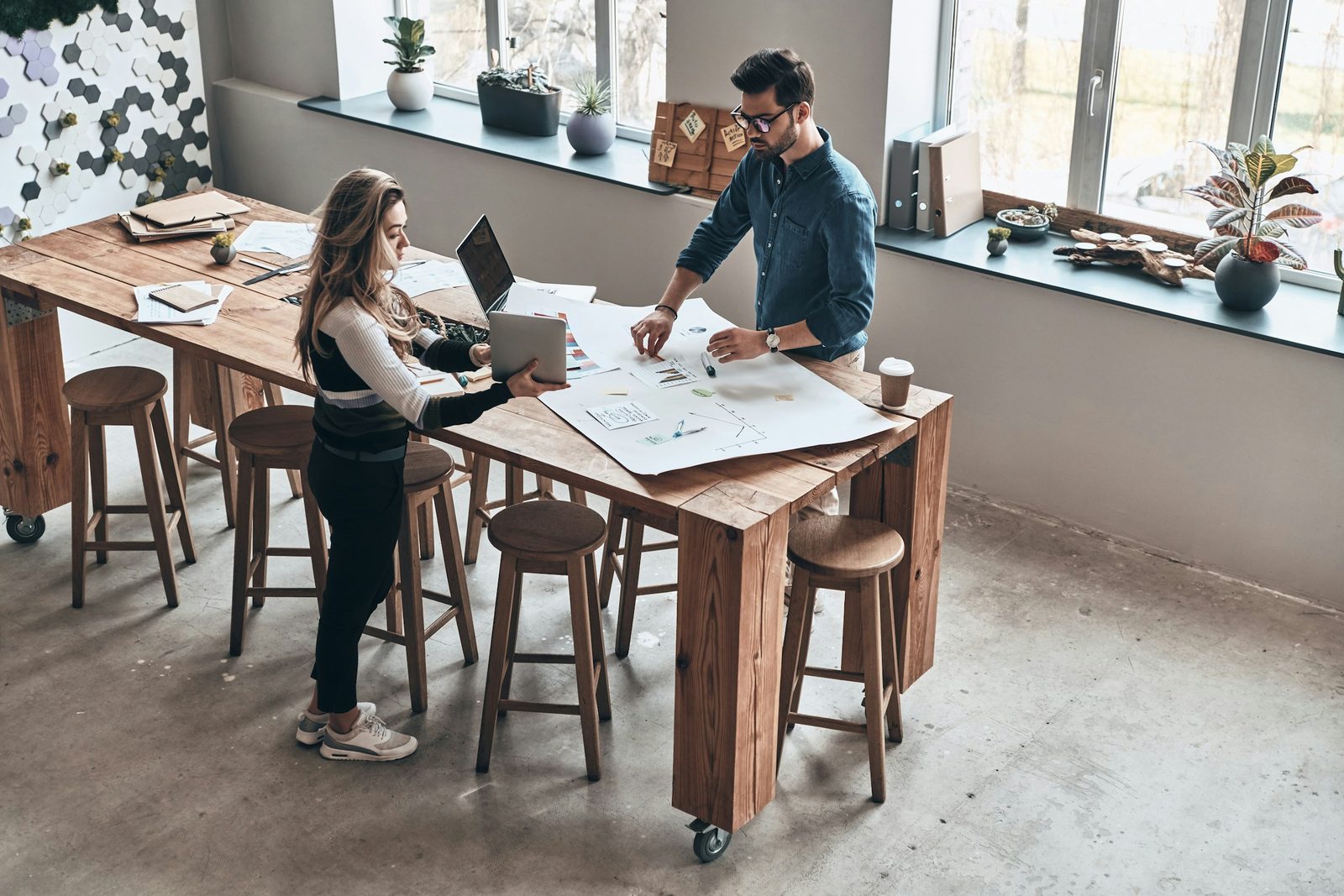 Entrepreneur reviewing several business documents at a table